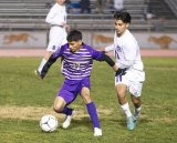 Lemoore's Damien Ramirez takes control of the ball against Mission Oak in a 4-1 soccer victory at Lemoore Wednesday night.